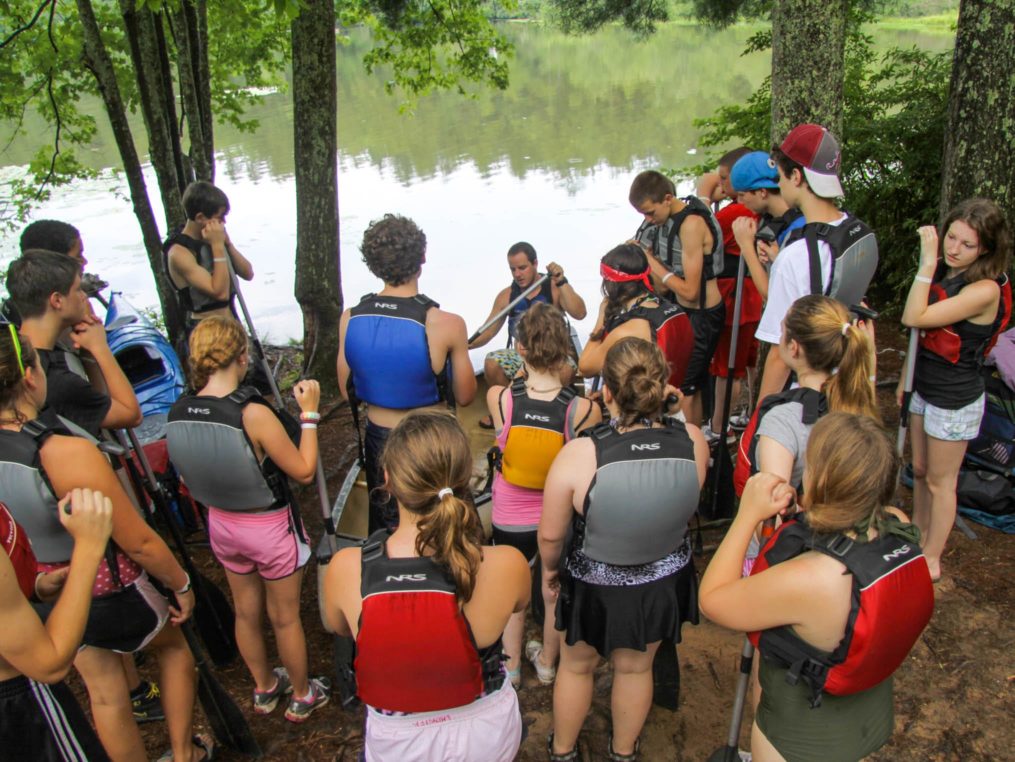 Staff leading a safety course on canoeing on the Rock Climbing & Canoeing Pioneer Expedition
