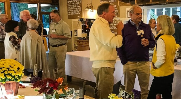 Guests chatting in the dining room