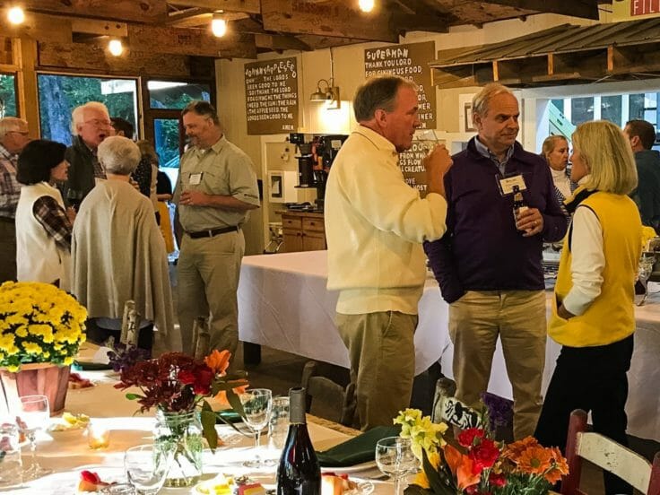Guests chatting in the dining room